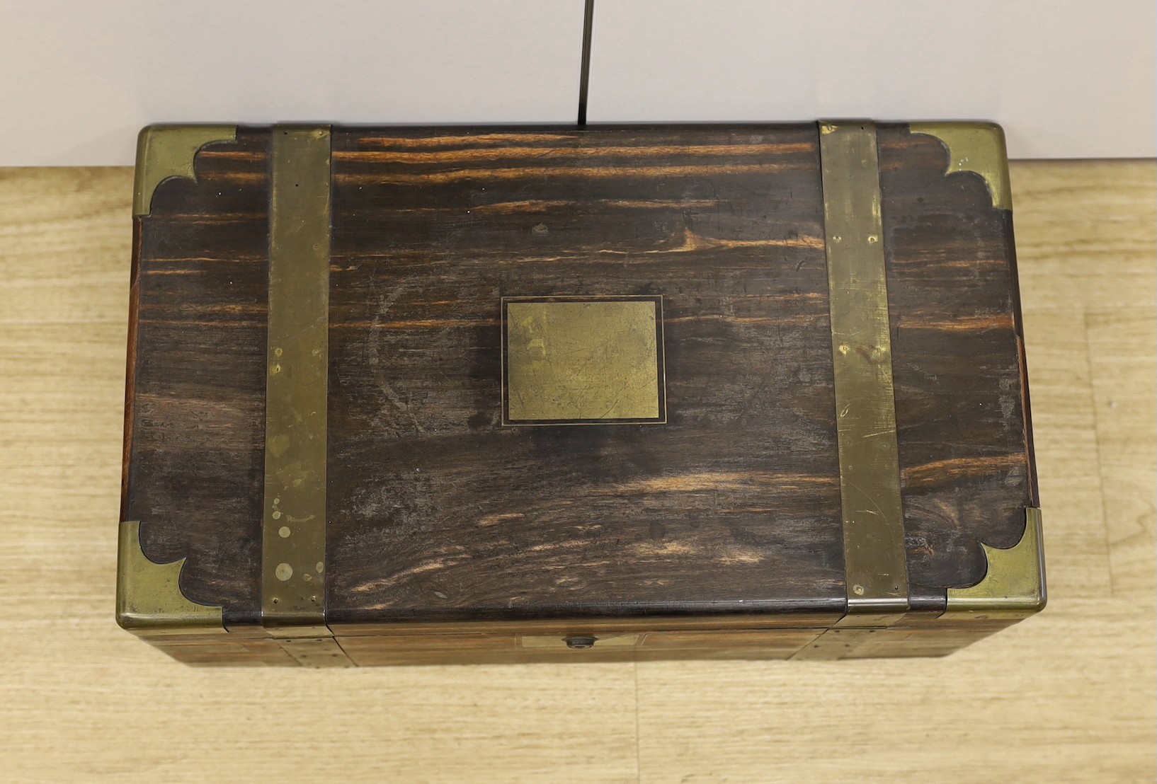 A boxed set of eight Banda carpet bowls, in a Victorian coromandel writing slope (a/f), 35cm wide